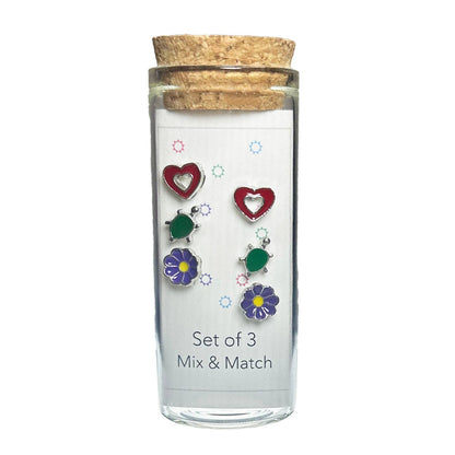 Three Pairs of Stud Earrings in a Glass Jar